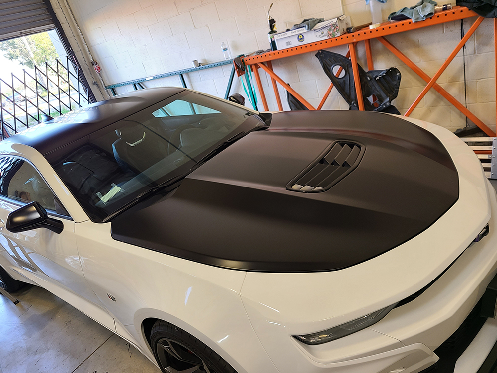 Morales signs Graphics hood wrap